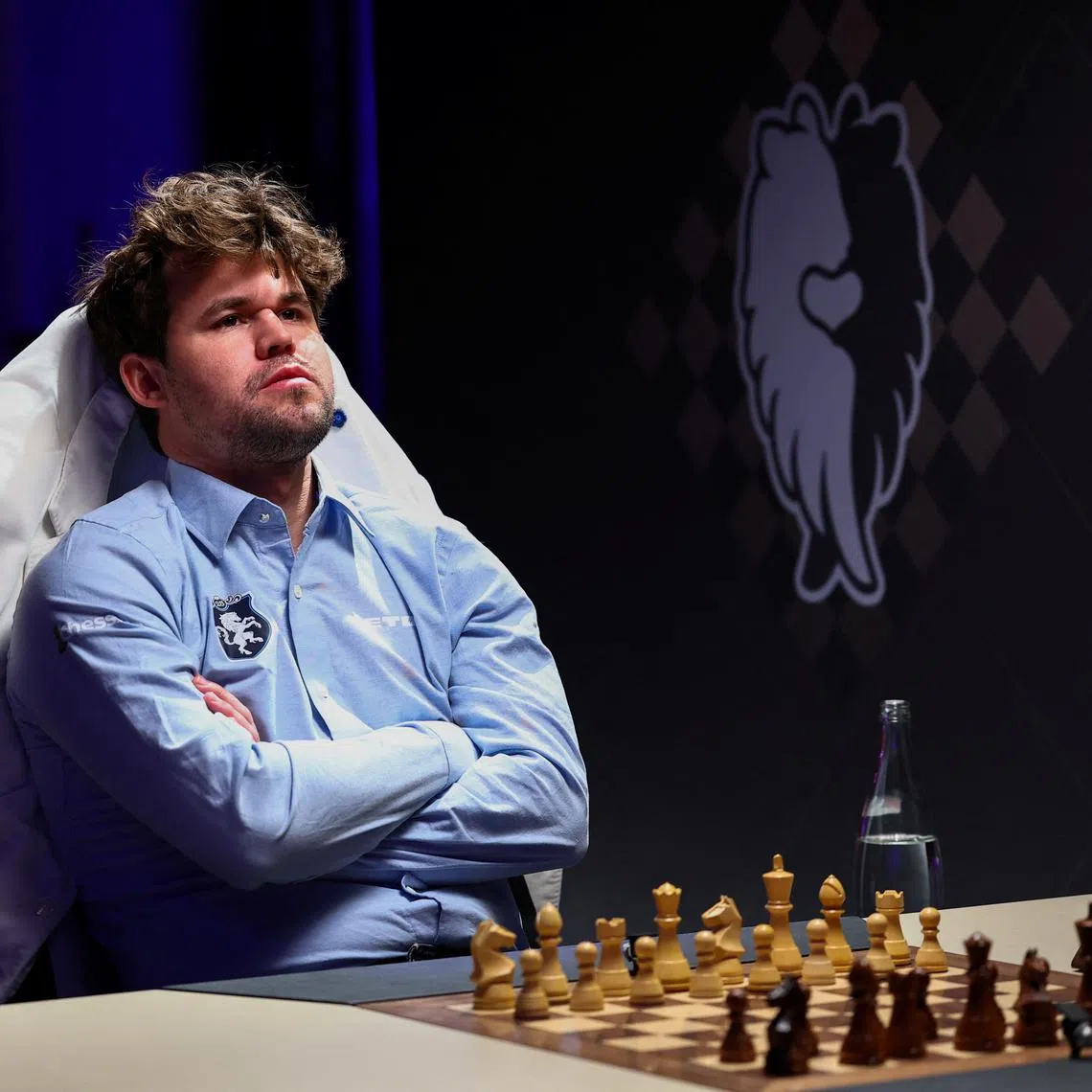 FILE PHOTO: Chess grandmaster Magnus Carlsen looks on ahead of the Freestyle Chess Grand Slam Tour in Paris, France, April 7, 2025. REUTERS/Gonzalo Fuentes