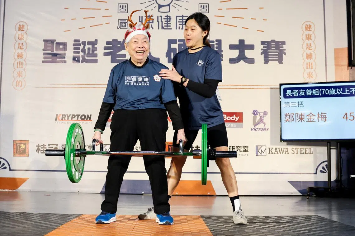 Cheng Chen Chin-Mei, 90, lifts 45kg as she breaks her personal record, at a weightlifting competition in Taipei, Taiwan December 21, 2024. REUTERS/Ann Wang