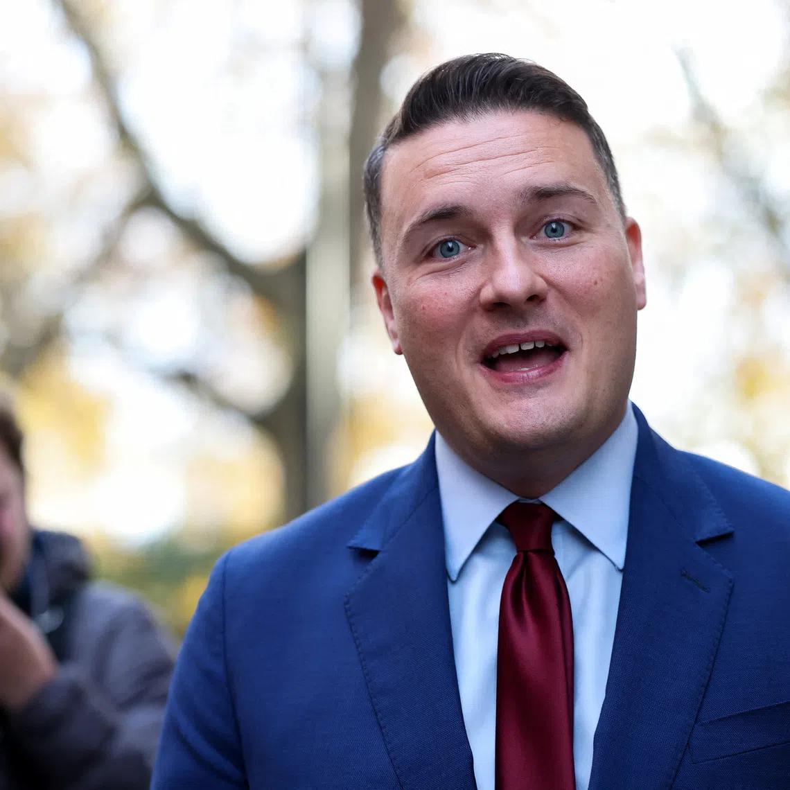 British Health Secretary Wes Streeting speaks to the media as he walks outside a television studios in London, Britain, November 12, 2025. REUTERS/Hannah McKay