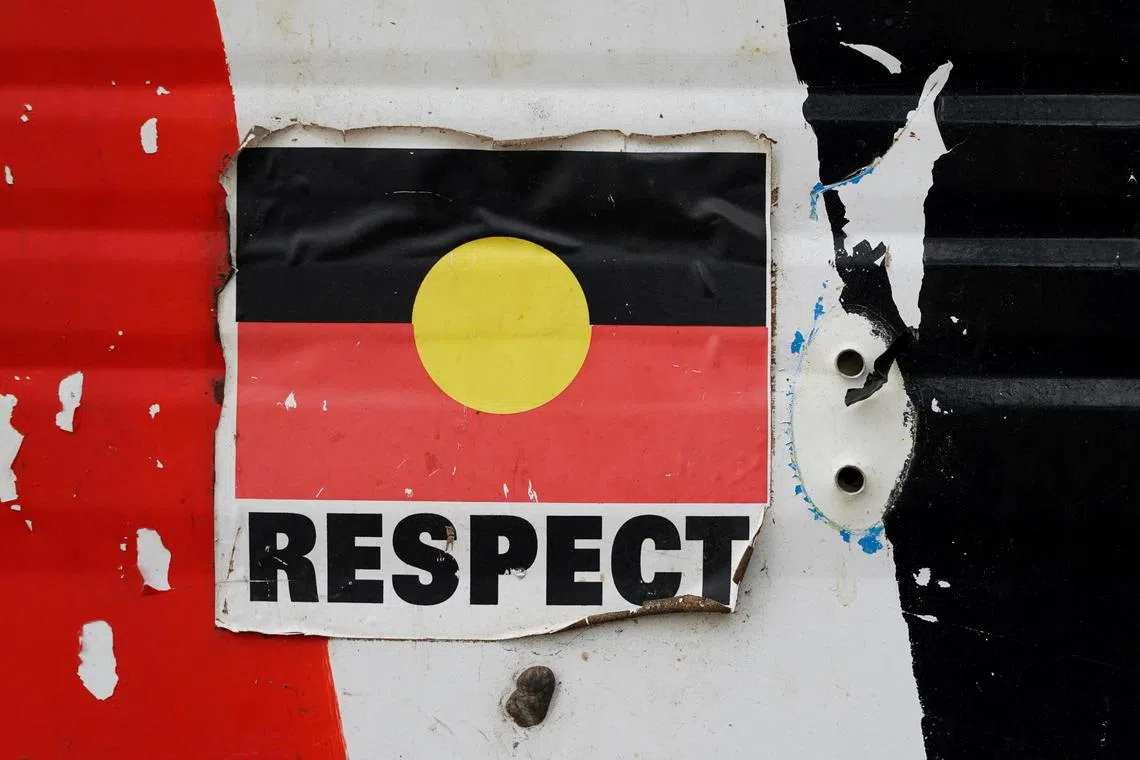 FILE PHOTO: A sticker of the Australian Aboriginal Flag along with the word "RESPECT" is pictured on a structure at the Aboriginal Tent Embassy, a site of protest since 1972, in Canberra, Australia, May 4, 2022. Picture taken May 4, 2022.  REUTERS/Loren Elliott/File Photo