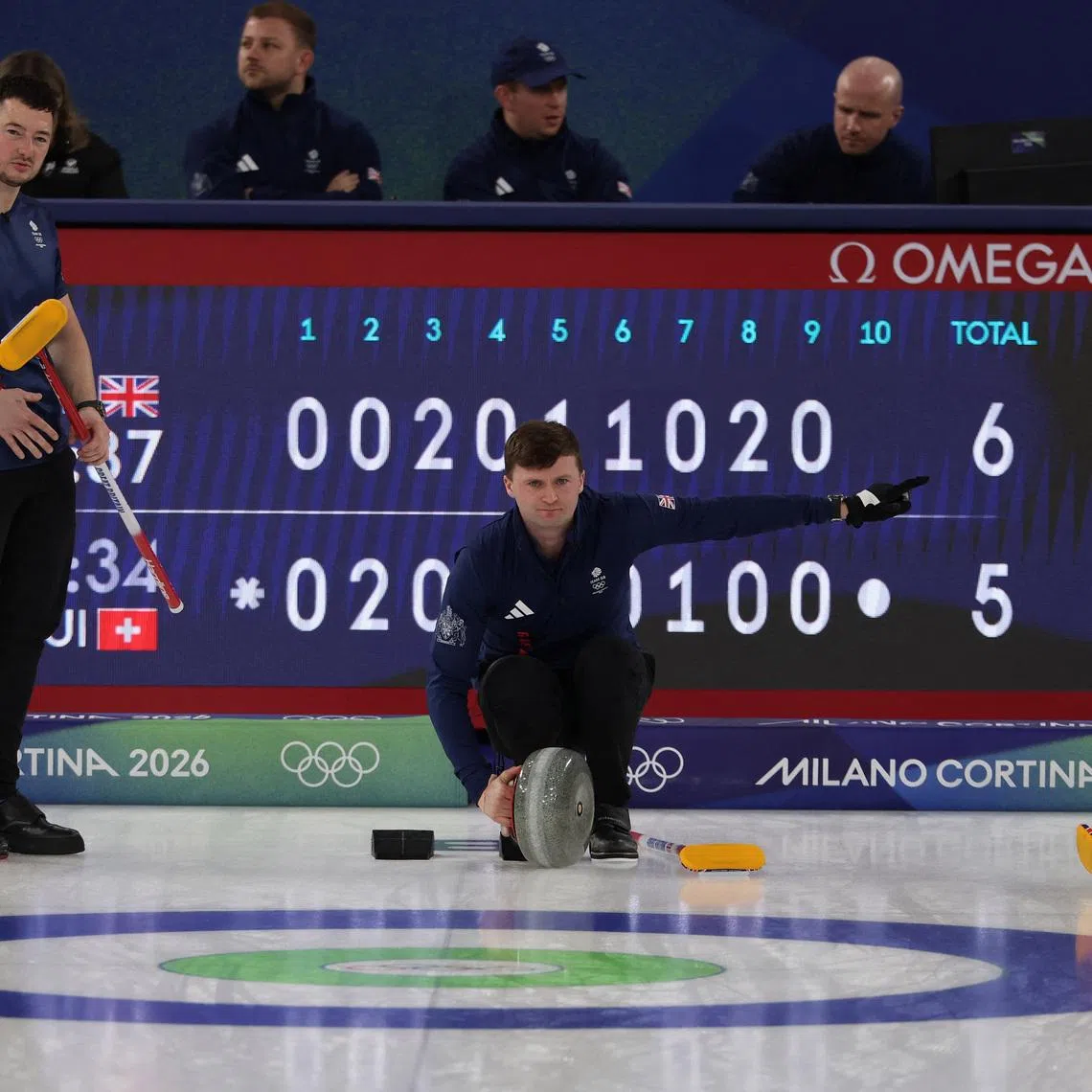 Milano Cortina 2026 Olympics - Curling - Men's Semi-final - Great Britain vs Switzerland - Cortina Curling Olympic Stadium, Cortina d'Ampezzo, Italy - February 19, 2026. Bruce Mouat of Britain, Hammy McMillan of Britain and Bobby Lammie of Britain during their match against Switzerland REUTERS/Issei Kato