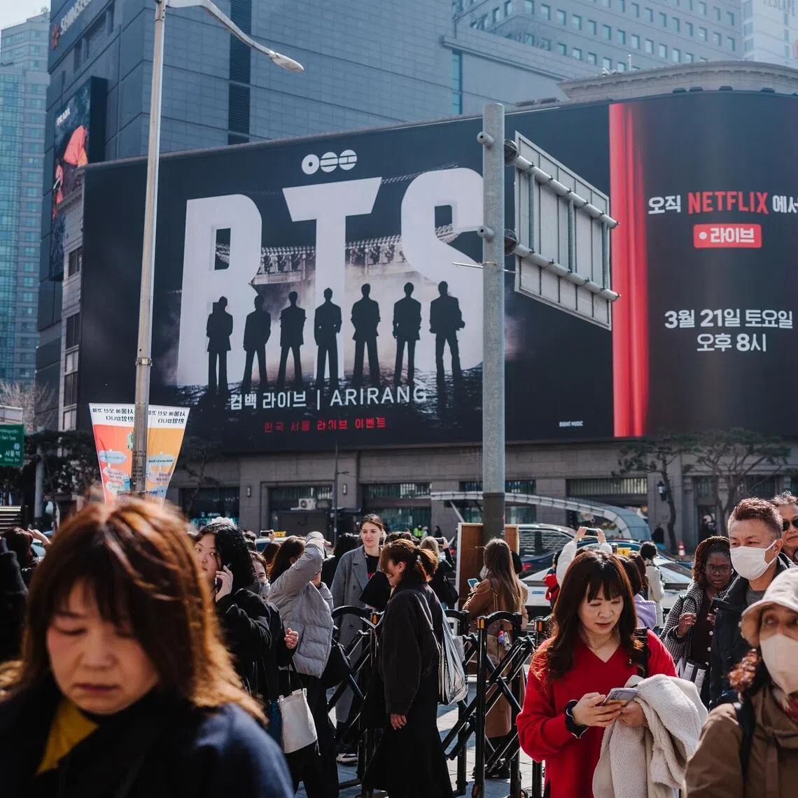 Fans disperse after the media show featuring BTS at Shinsegae Square in Seoul, South Korea, Mar. 21, 2026. The group performed their first concert in three years, five months and six days, as obsessive fans point out. (Jun Michael Park/The New York Times)