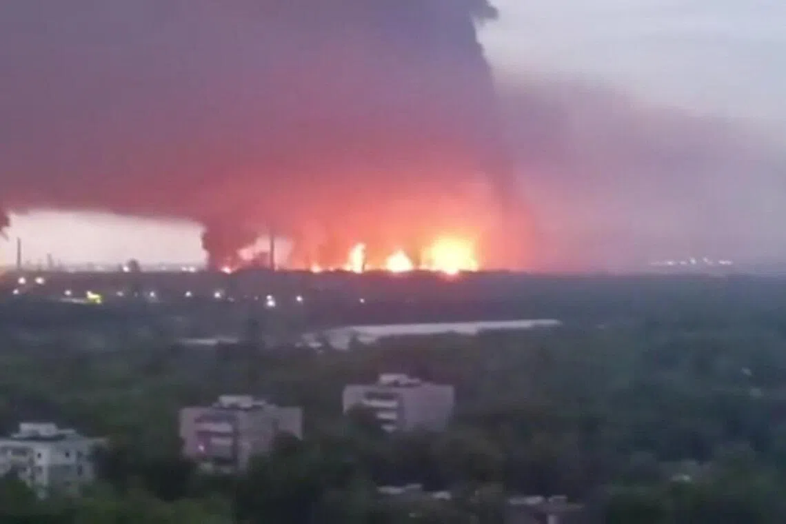 Fire and a thick plume of smoke rising in the vicinity of the Ryazan oil refinery, in Russia's Ryazan region, on May 15, in a screengrab from a social media video. 