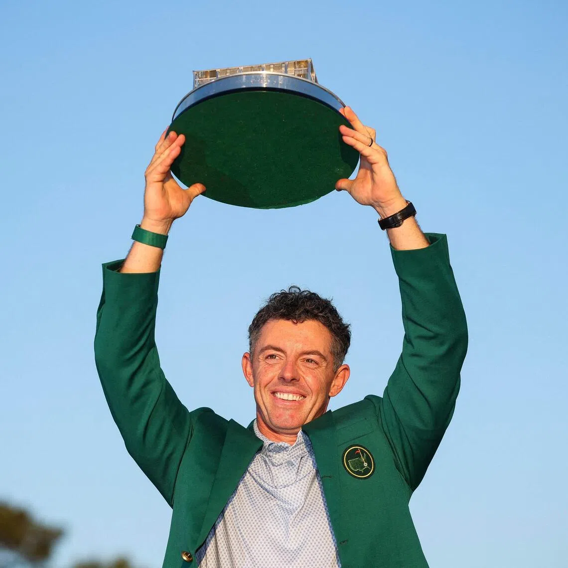 Rory McIlroy lifting the Masters trophy at Augusta National Golf Club on April 12.