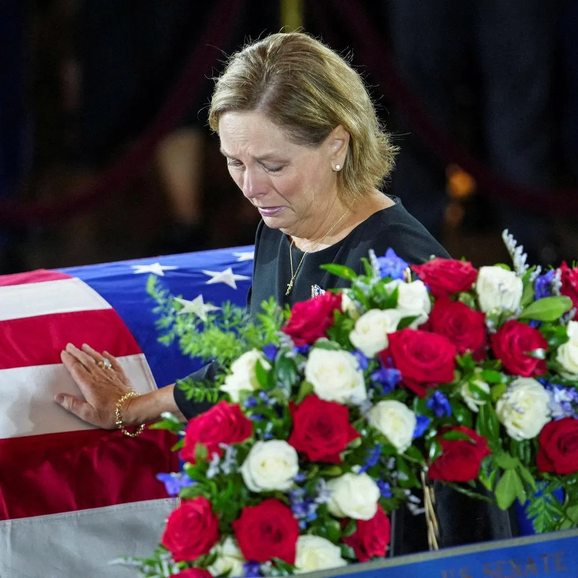 U.S. Senator Darline Graham (R-SC), sister of late U.S. Senator Lindsey Graham (R-SC), mourns by his casket, during a Congressional Tribute to late U.S. Senator Lindsey Graham (R-SC) at the Rotunda of the U.S. Capitol in Washington, D.C., U.S., July 28, 2026. REUTERS/Nathan Howard/Pool