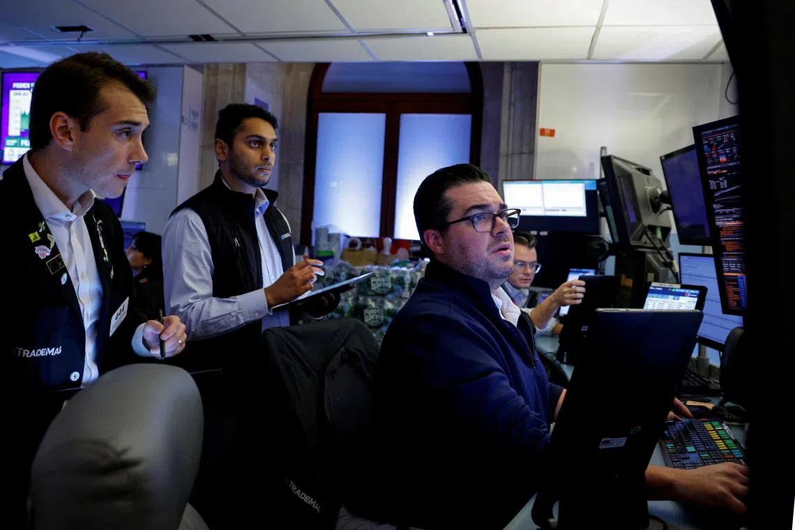 Traders working on the floor of the New York Stock Exchange, in New York City, on Sept 19.