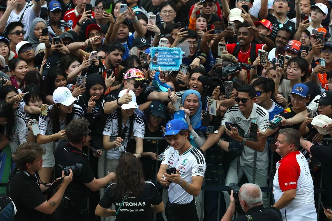 Mercedes’ Italian driver Andrea Kimi Antonelli taking a wefie with fans at the Formula 1 Bahrain Grand Prix in Malaysia, in Sepang, on Oct 1. The championship leader is raring to bounce back after fifth place in Baku, Azerbaijan last weekend.