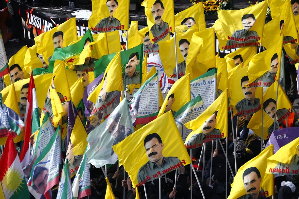 People carry flags depicting imprisoned Kurdish rebel leader Abdullah Ocalan during a demonstration organised by Kurds in Hanover, Germany, March 17, 2018. REUTERS/Ralph Orlowski