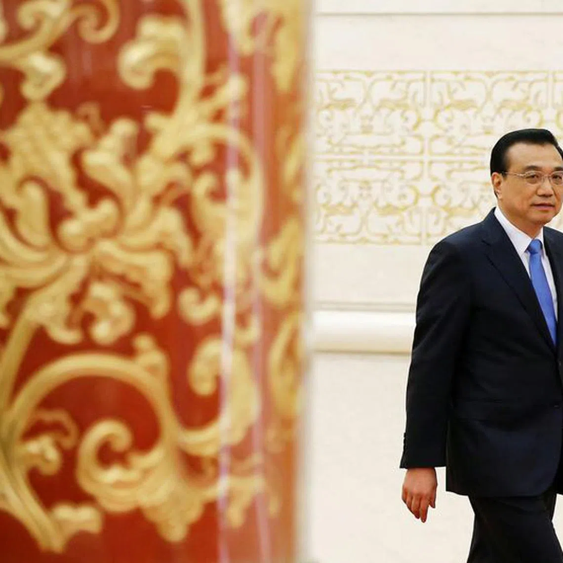 FILE PHOTO: China's Premier Li Keqiang arrives for a news conference after the closing ceremony of China's National People's Congress (NPC) at the Great Hall of the People in Beijing, China, March 15, 2017. REUTERS/Damir Sagolj/File Photo