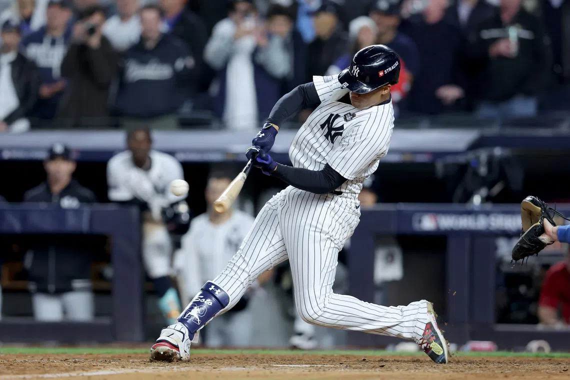 Oct 29, 2024; New York, New York, USA; New York Yankees outfielder Juan Soto (22) doubles during the eighth inning against the Los Angeles Dodgers in game four of the 2024 MLB World Series at Yankee Stadium. Brad Penner-Imagn Images/File Photo