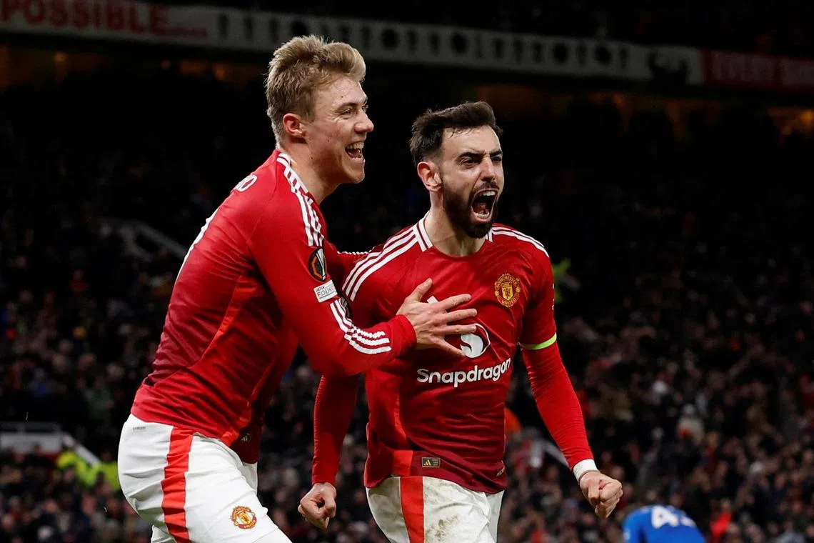 Manchester United's Bruno Fernandes celebrates scoring their second goal with Rasmus Hojlund in their