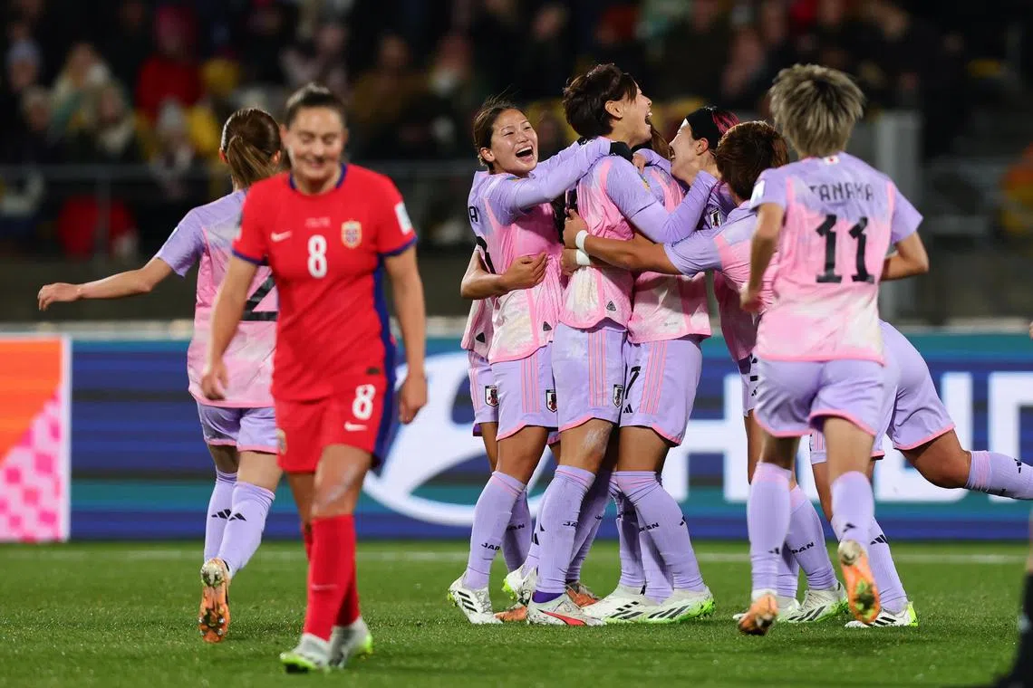 Japan celebrate their first goal, an own goal by Ingrid Syrstad Engen of Norway, in their 3-1 Women's World Cup last-16 win.
