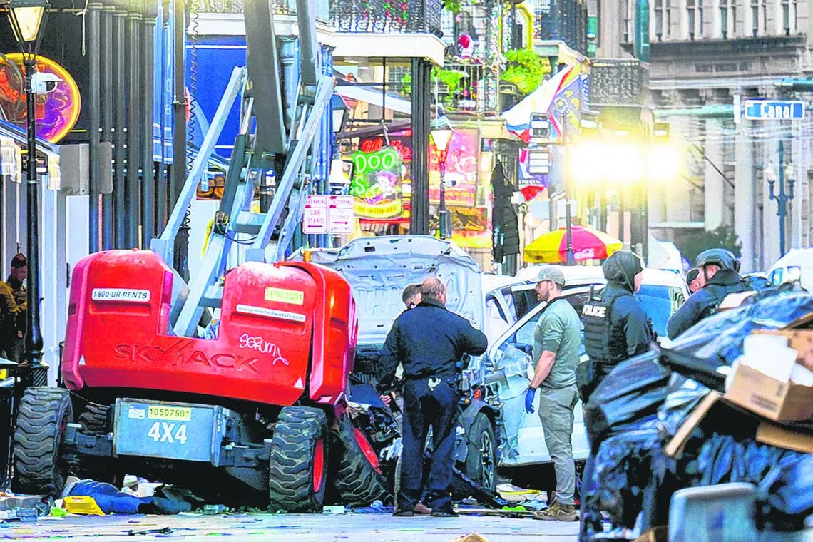 Police investigators surrounding a white truck that has been crashed into a work lift in the French Quarter of New Orleans, Louisiana, on Jan 1. At least 10 people were killed and 30 injured when a vehicle plowed into a New Year's crowd.