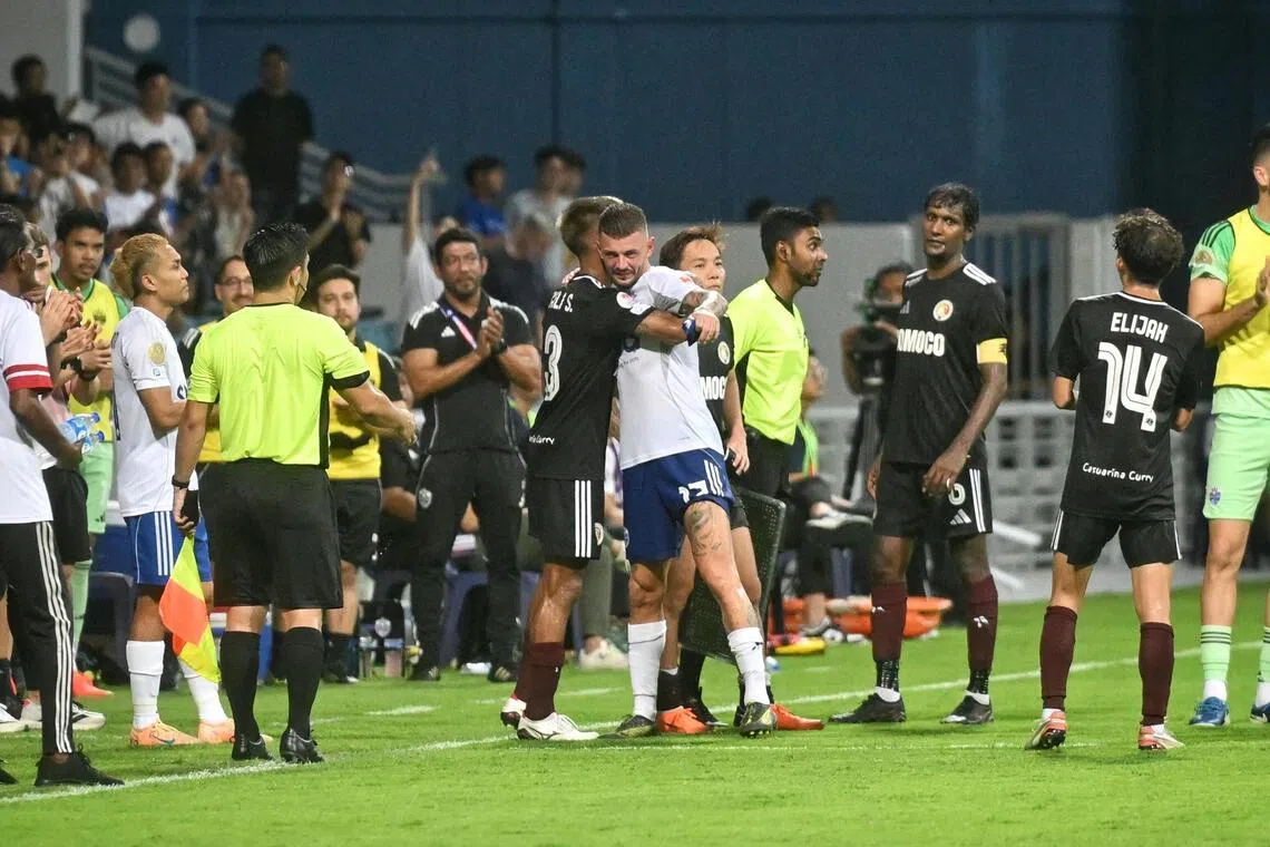 Departing Lion City Sailors winger Maxime Lestienne is cheered on by fans and players as he makes his way off the pitch after being substituted. 