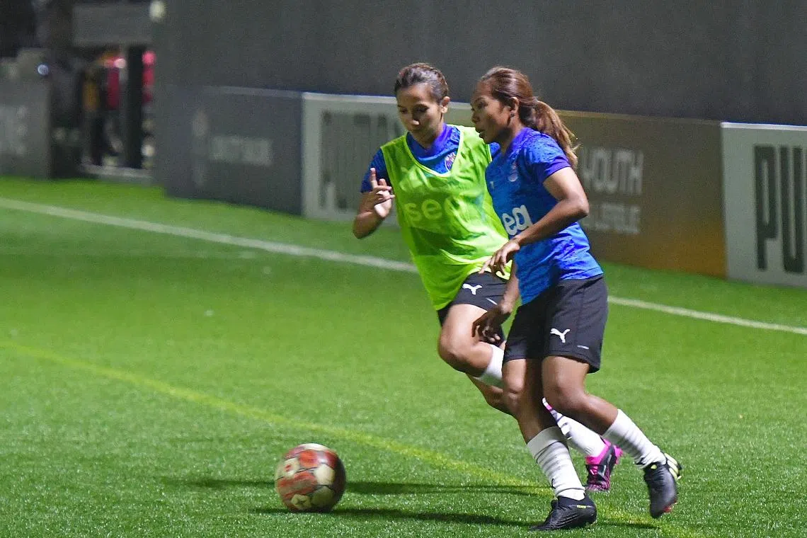 Lion City Sailors' Nur Izzati Rosni (left) and Ernie Sulastri Sontaril joined Malaysian side FC SWAT for a month to prepare for the 2023 Women's Premier League season.