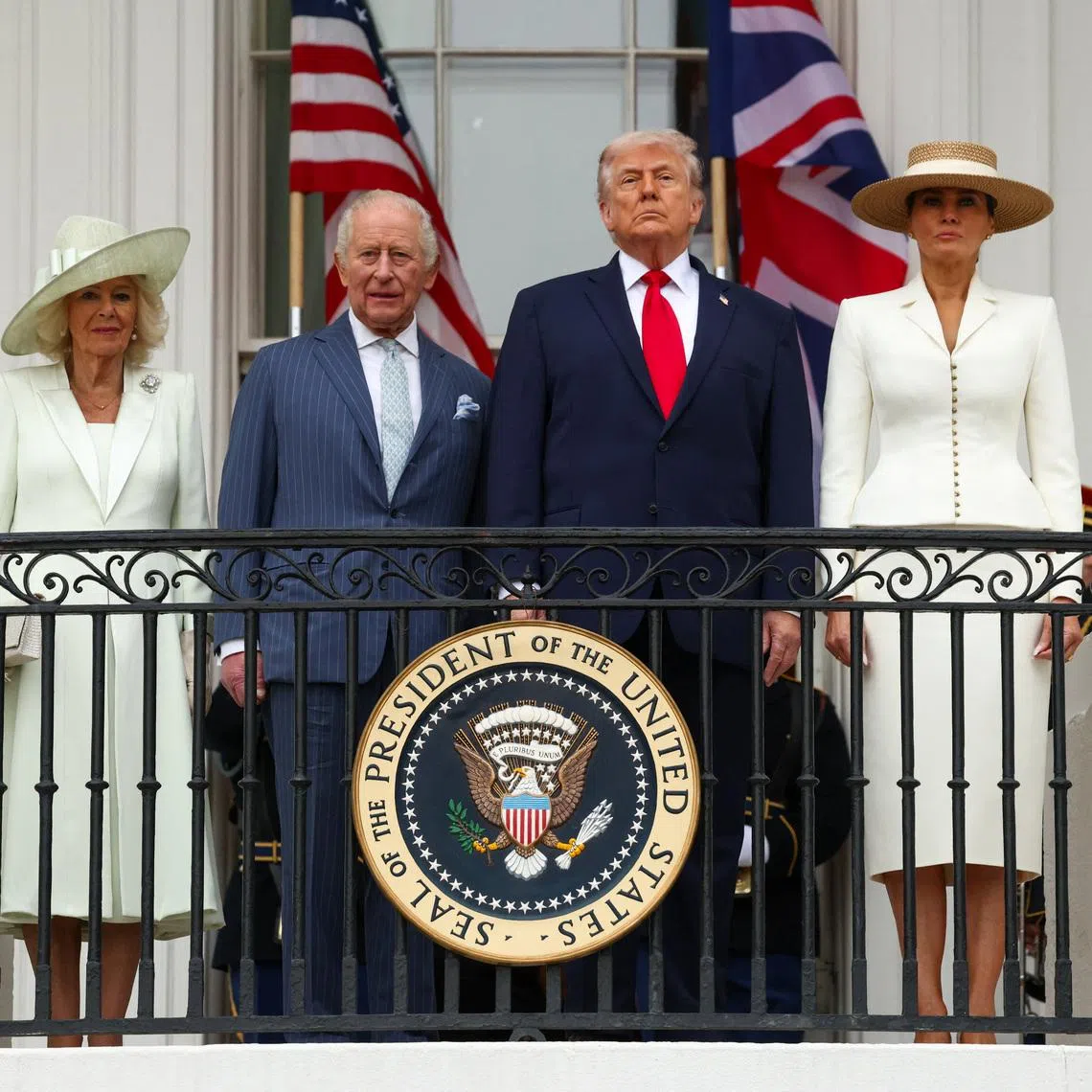 The Trumps, Britain's King Charles and Queen Camilla watch a pass in review during an arrival ceremony for the king and queen on the South Lawn of the White House on April 28.