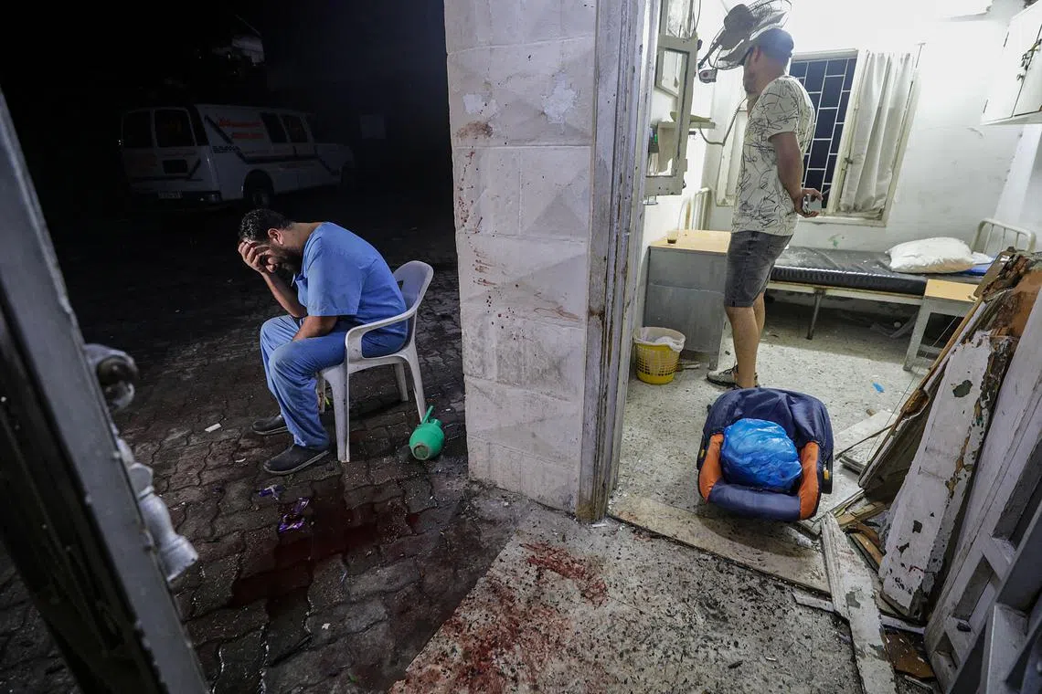 A doctor at the scene of Al Ahli hospital after an air strike in Gaza City on October 17, 2023. According to Palestinian officials hundreds of people have been killed in an Israeli strike on a hospital.Earlier in the day, the Palestinian Health Ministry announced that more than 3,000 Palestinians have been killed and over 12,500 others injured since Israel launched retaliatory air strikes in the Gaza Strip. 