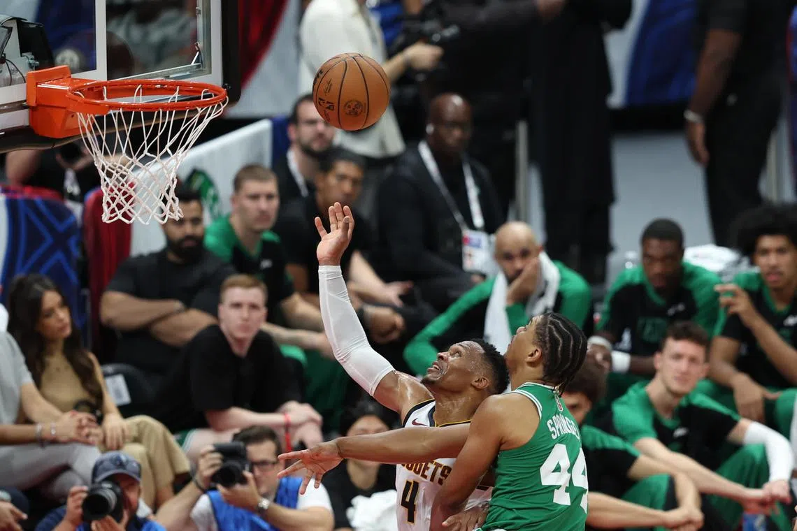 Jaden Springer of Boston Celtics and Russell Westbrook of Denver Nuggets in action during the NBA Abu Dhabi Games 2024.