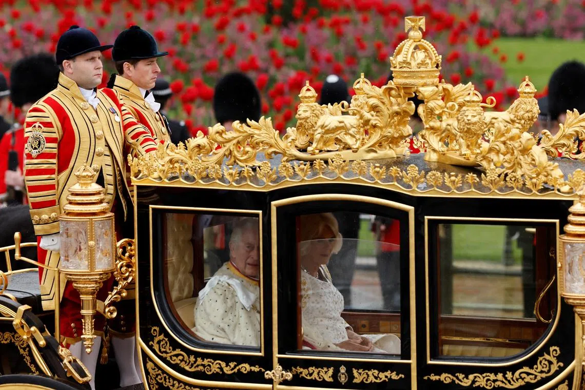Britain's King Charles and Queen Camilla traveling in the Diamond Jubilee State Coach from Buckingham Palace to Westminster Abbey to their coronation ceremony in London, Britain May 6, 2023. 
