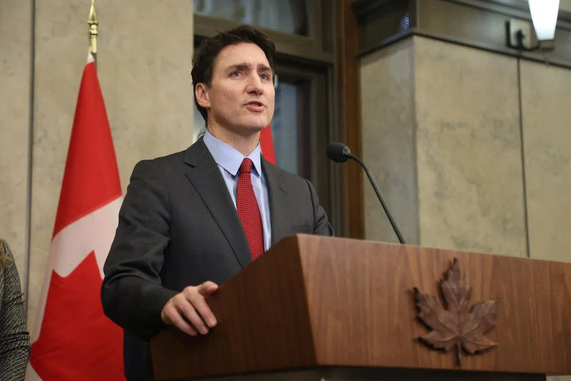 FILE PHOTO: Canada's Prime Minister Justin Trudeau speaks during a press conference while responding to U.S. President Donald Trump's orders to impose 25% tariffs on Canadian imports, in Ottawa, Ontario, Canada February 1, 2025. REUTERS/Patrick Doyle/File Photo