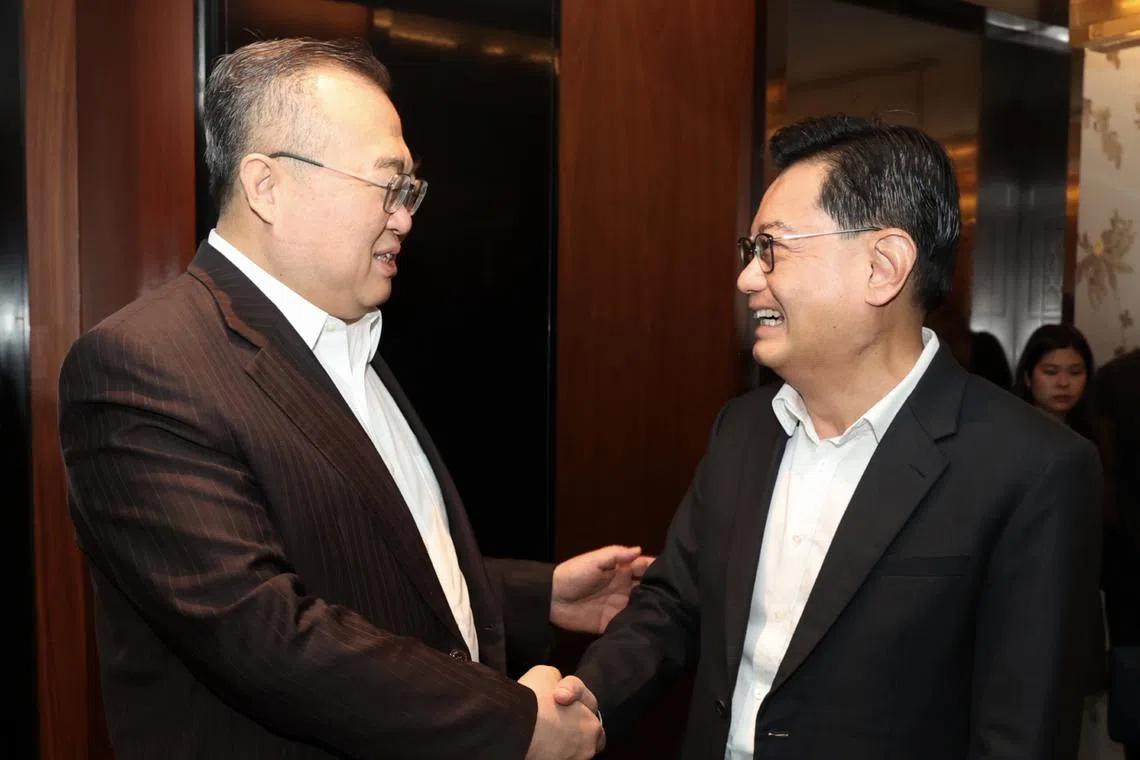 Minister of the International Department of the Communist Party of China Liu Jianchao (left) hosted Deputy Prime Minister Heng Swee Keat in Beijing on March 25.