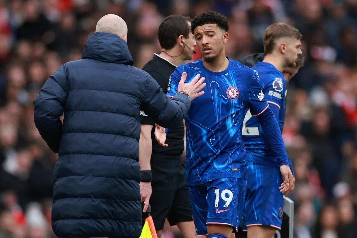 Jadon Sancho and Chelsea manager Enzo Maresca about to shake hands after the attacker is taken off during the 1-0 English Premier League loss to Arsenal at the Emirates on March 16.