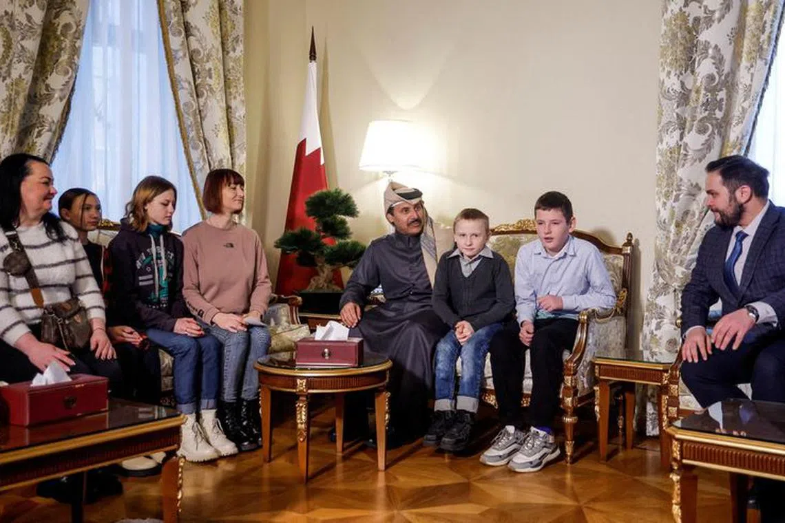 FILE PHOTO: Sheikh Ahmed bin Nasser Al Thani, ambassador of Qatar to Russia, and Alexey Ghazaryan, head of the Office of the Commissioner for Children's Rights under the President of the Russian Federation, meet Ukrainian children and their family members before their departure to Ukraine from Russia under a deal brokered by Qatar, amid Russia's attack on Ukraine, at the Qatari embassy in Moscow, Russia December 5, 2023. REUTERS/Maxim Shemetov/File Photo
