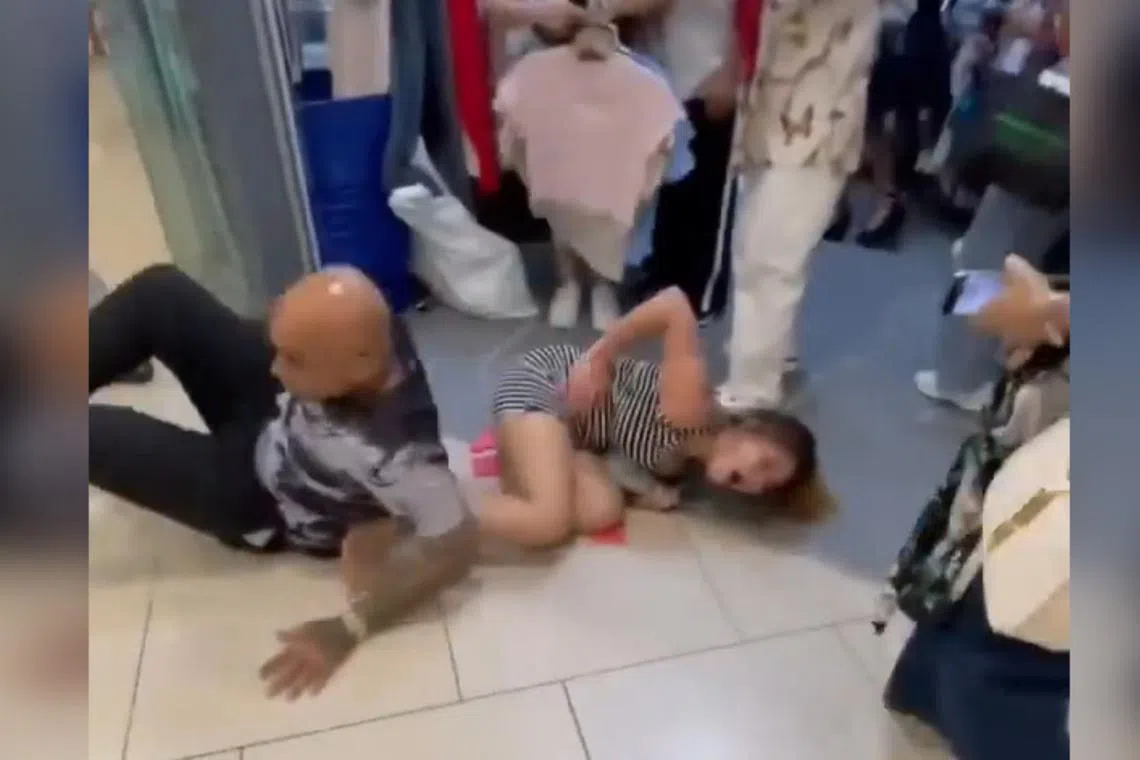 In videos circulating online, a man is seen kicking the woman, causing her to fall, before kicking again while she was still down.