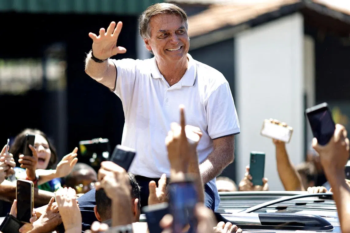 FILE PHOTO: Former Brazilian President Jair Bolsonaro gestures to his supporters after a state meeting of the Liberal Party, in Goiania, Brazil, April 4, 2024. REUTERS/Ueslei Marcelino/File Photo