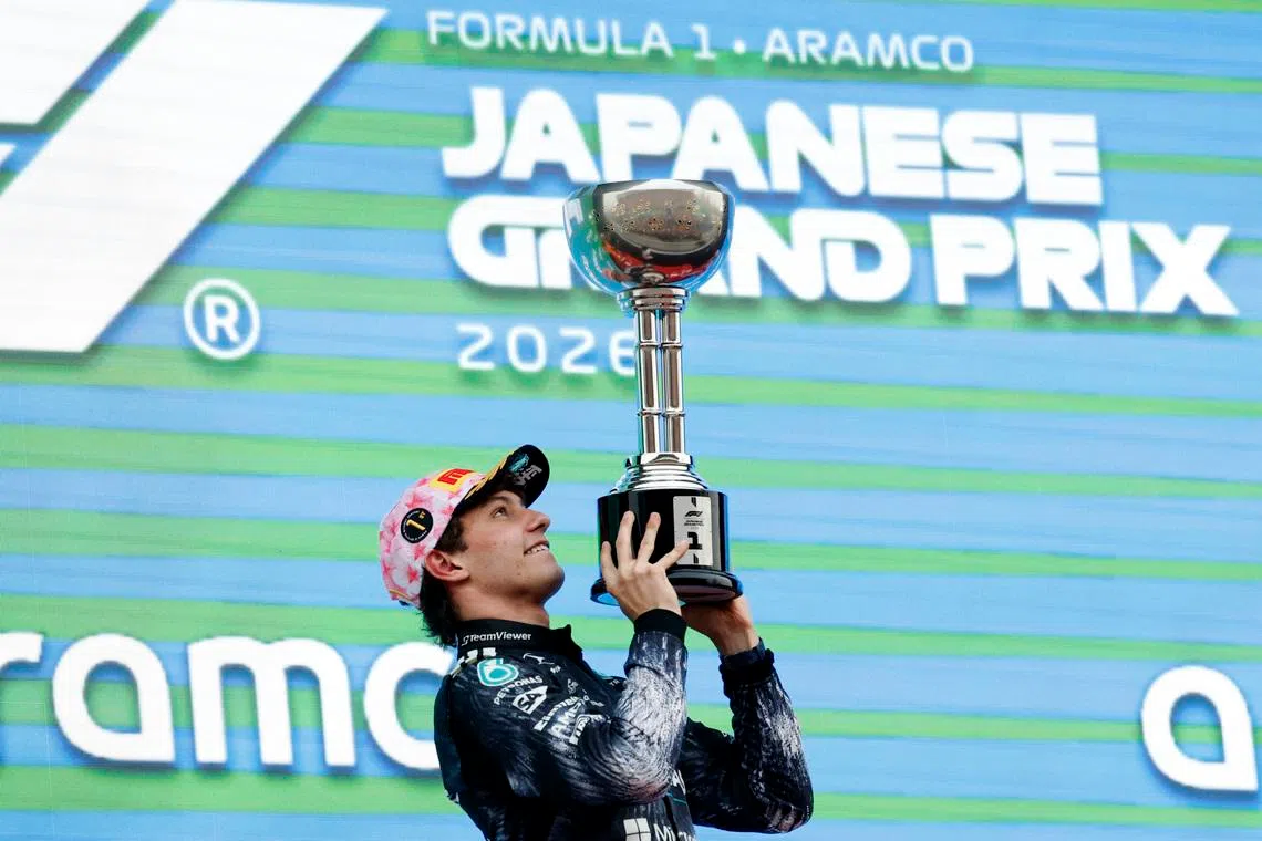 Formula One F1 - Japanese Grand Prix - Suzuka Circuit, Suzuka, Japan - March 29, 2026 Mercedes' Andrea Kimi Antonelli celebrates on the podium with the trophy after winning the Japanese Grand Prix REUTERS/Kim Kyung-Hoon