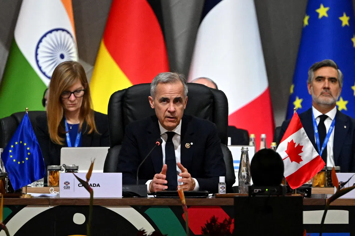 Canadian Prime Minister Mark Carney speaks during the opening plenary session at the G20 Summit on November 22, 2025 in Johannesburg, South Africa, Leon Neal/Pool via REUTERS