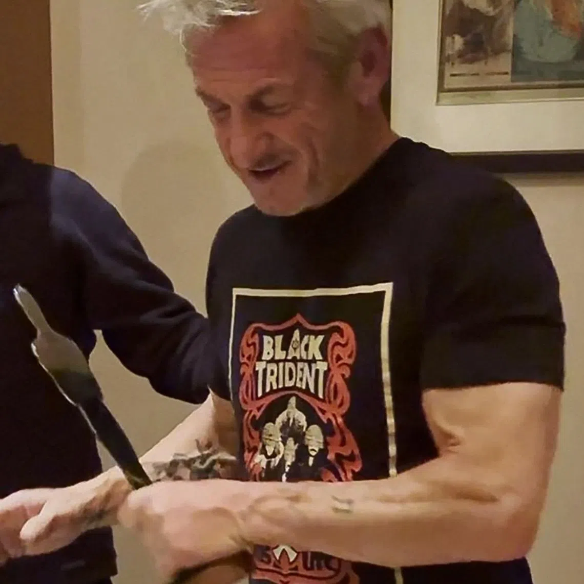 US actor Sean Penn is presented with a silver statue in the shape of an Oscar during his visit to Ukraine.