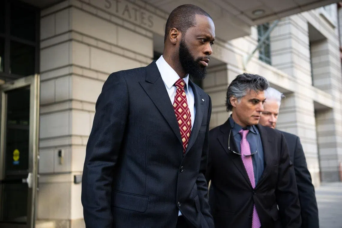 Pras Michel, former member of the Fugees, exits a federal court in Washington on Monday.