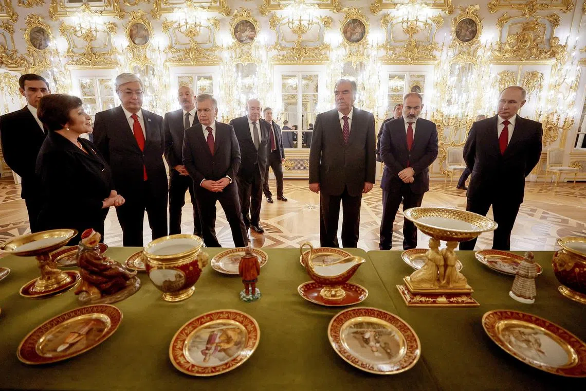 Turkmen President Serdar Berdymukhamedov, Kazakh President Kassym-Jomart Tokayev, Azeri President Ilham Aliyev, Uzbek President Shavkat Mirziyoyev, Tajik President Emomali Rakhmon, Armenian Prime Minister Nikol Pashinyan and Russian President Vladimir Putin visit the Peterhof Palace in Saint Petersburg, Russia Dec 26, 2023. 
