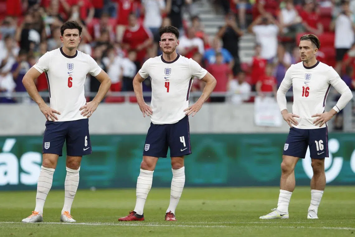 Soccer Football - UEFA Nations League - Group C - Hungary v England - Puskas Arena Park, Budapest, Hungary - June 4, 2022
England's Harry Maguire, Declan Rice and Jack Grealish look dejected after Hungary are awarded a penalty REUTERS/Bernadett Szabo