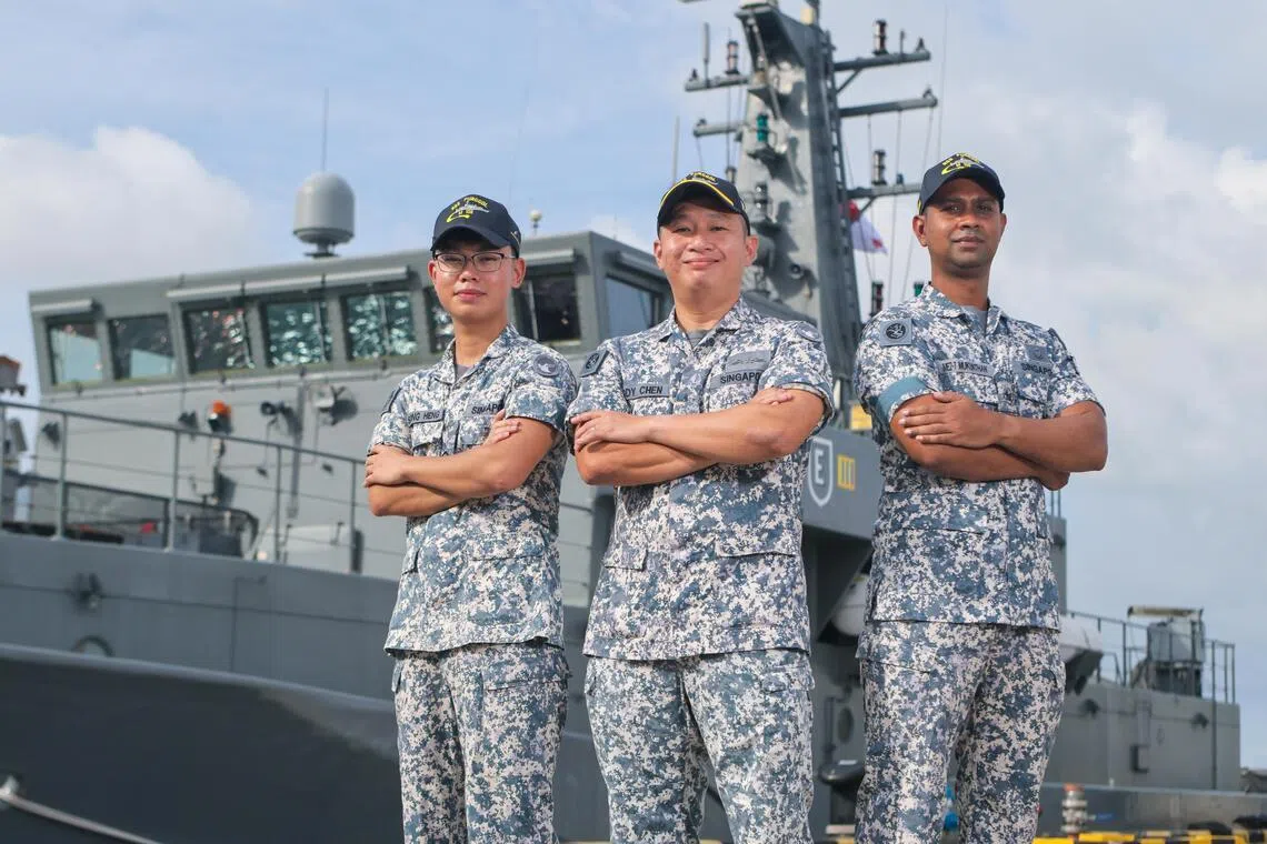 RSS Punggol commanding officer Major Chen Qinghe (middle) with underwater system operator Second Sergeant Goh Song Heng (left) and marine system supervisor Military Expert 2 Mukunthan Subramaniam in front of the vessel. RSS Punggol was named Best Maritime Security Unit.