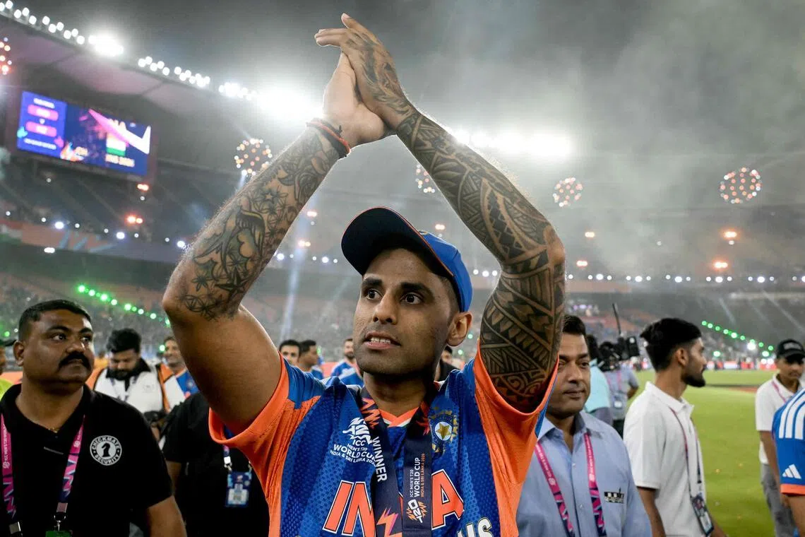 India's captain Suryakumar Yadav greets fans during a victory lap after winning the 2026 ICC Men's T20 Cricket World Cup final against New Zealand at the Narendra Modi Stadium in Ahmedabad on March 8, 2026.
