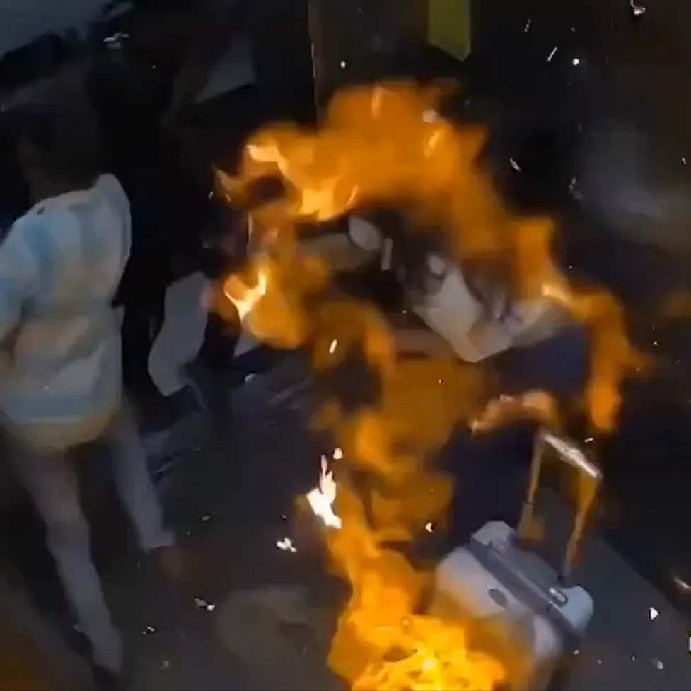 CCTV footage of the incident shows the bag of balloons suddenly combusting, engulfing the lift in flames for a split second.