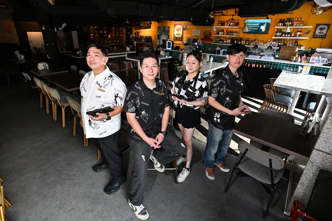 ST20250102-202504800475-Lim Yaohui-Joyce Lim-jltipsy/
(From left) Mr Imran Bin Mohamed Jais​, 45, supervisor​; Mr ​Jason ​Lim ​Dian ​Xiong​, 37, assistant man​ager​; Ms Kelwen Liew​, 28, events ​manager; and Mr ​Derrick ​Leong ​Wing ​Cheong​, 39, supervisor​, inside Tipsy Penguin gastropub at NTUC Income@Tampines Junction on Jan 2, 2025.
After a period of salary delays and food shortages, Tipsy's employees have finally received their full wages and CPF contributions on time.
(ST PHOTO: LIM YAOHUI)