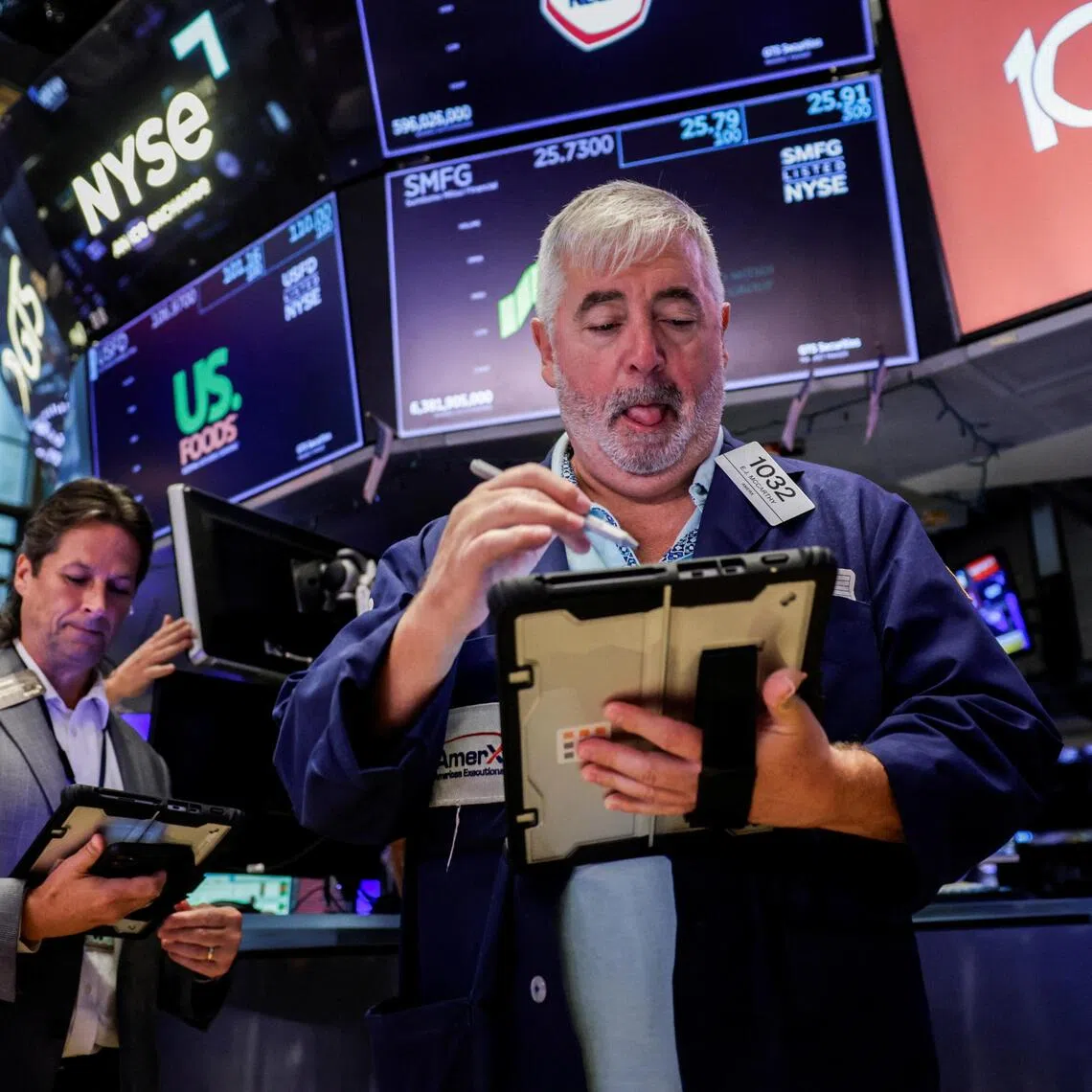 Traders working on the floor of the New York Stock Exchange, in New York City, on Aug 7.