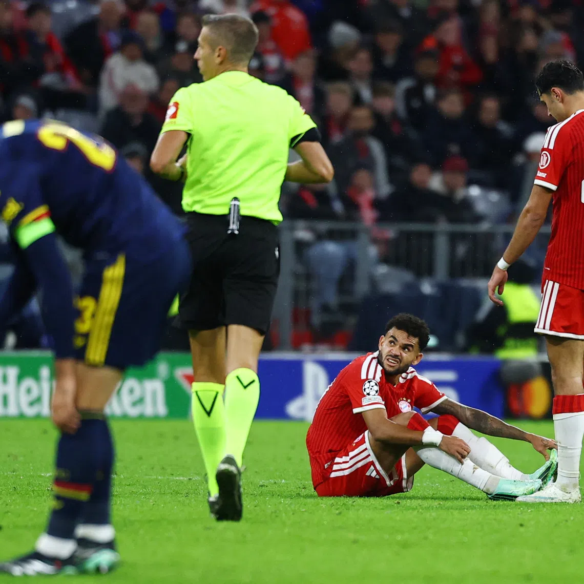Soccer Football - UEFA Champions League - Bayern Munich v Arsenal - Allianz Arena, Munich, Germany - October 21, 2026  Bayern Munich's Luis Diaz down injured REUTERS/Kai Pfaffenbach