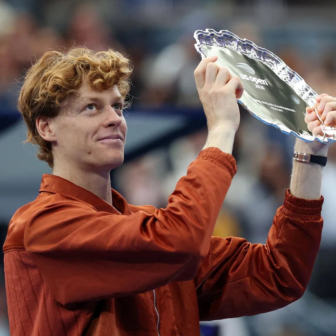 Tennis - U.S. Open - Flushing Meadows, New York, United States - September 7, 2025 Italy's Jannik Sinner holds the runner up trophy after losing the men's singles final to Spain's Carlos Alcaraz REUTERS/Mike Segar