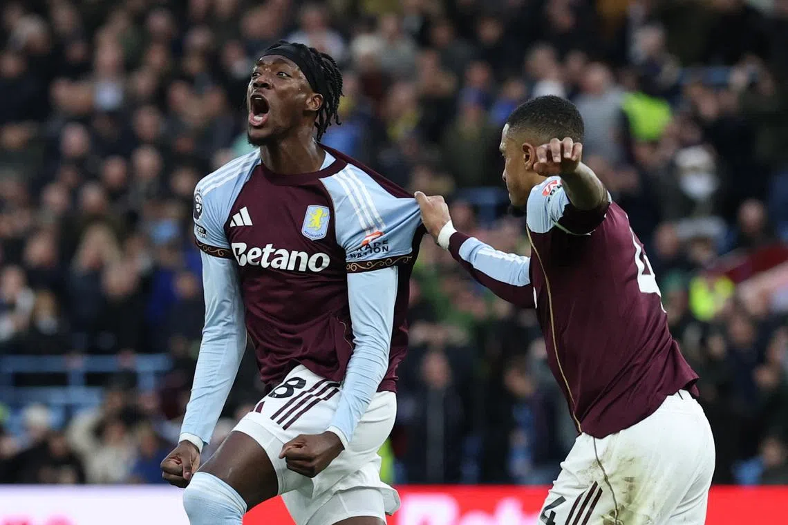 Soccer Football - Premier League - Aston Villa v Leeds United - Villa Park, Birmingham, Britain - February 21, 2026 Aston Villa's Tammy Abraham celebrates scoring their first goal with Ezri Konsa Action Images via Reuters/Paul Childs