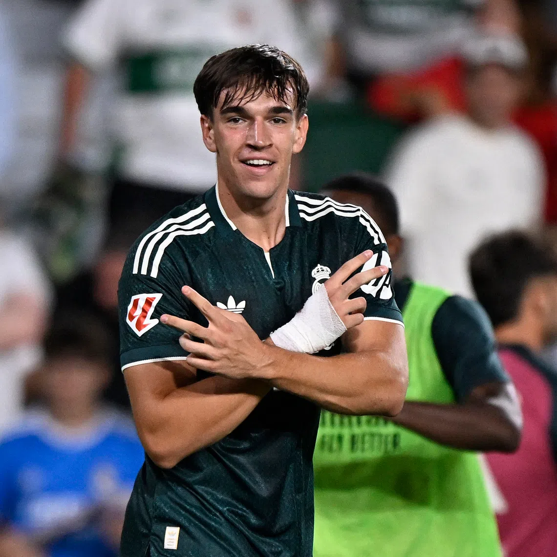 Real Madrid’s Carlos Espi celebrates scoring the winner for his side.