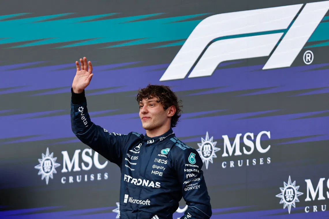 Mercedes’ Kimi Antonelli celebrates on the podium after winning the United States Grand Prix.