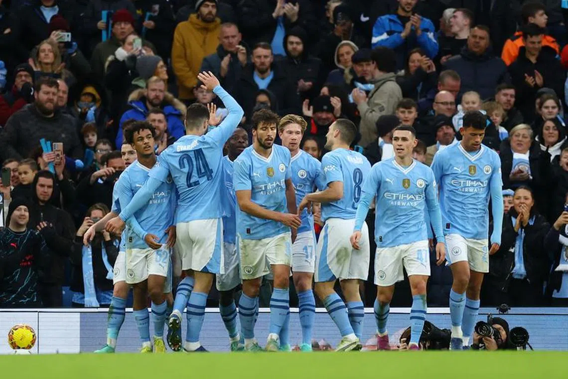 Soccer Football -  FA Cup - Third Round - Manchester City v Huddersfield Town - Etihad Stadium, Manchester, Britain - January 7, 2024 Manchester City's Jeremy Doku celebrates scoring their fifth goal with teammates REUTERS/Carl Recine