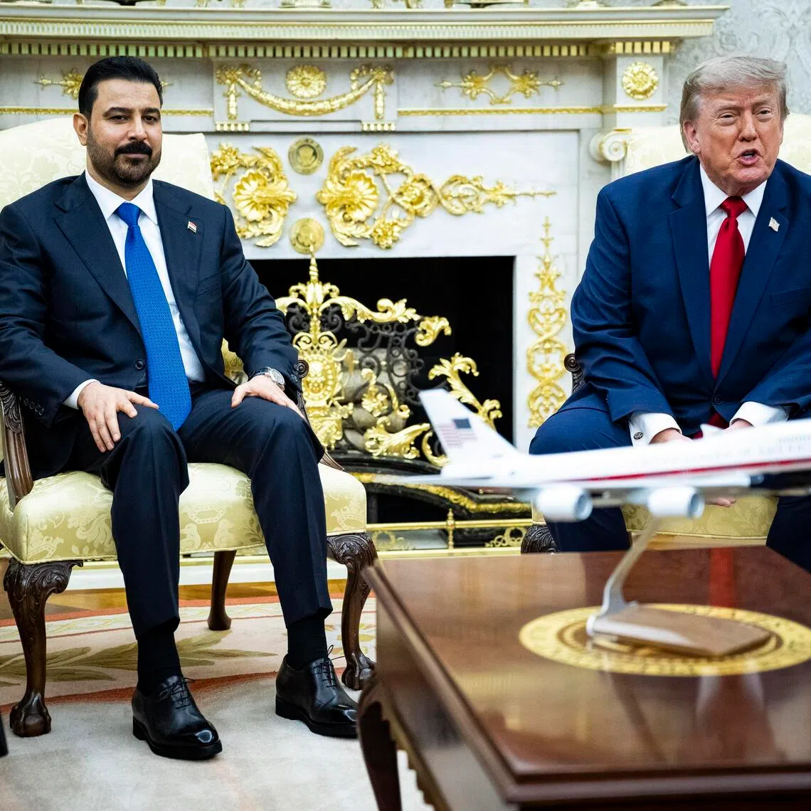 US President Donald Trump (right) speaks during a meeting with Iraqi Prime Minister Ali al-Zaidi (left) in the Oval Office of the White House on July 14.