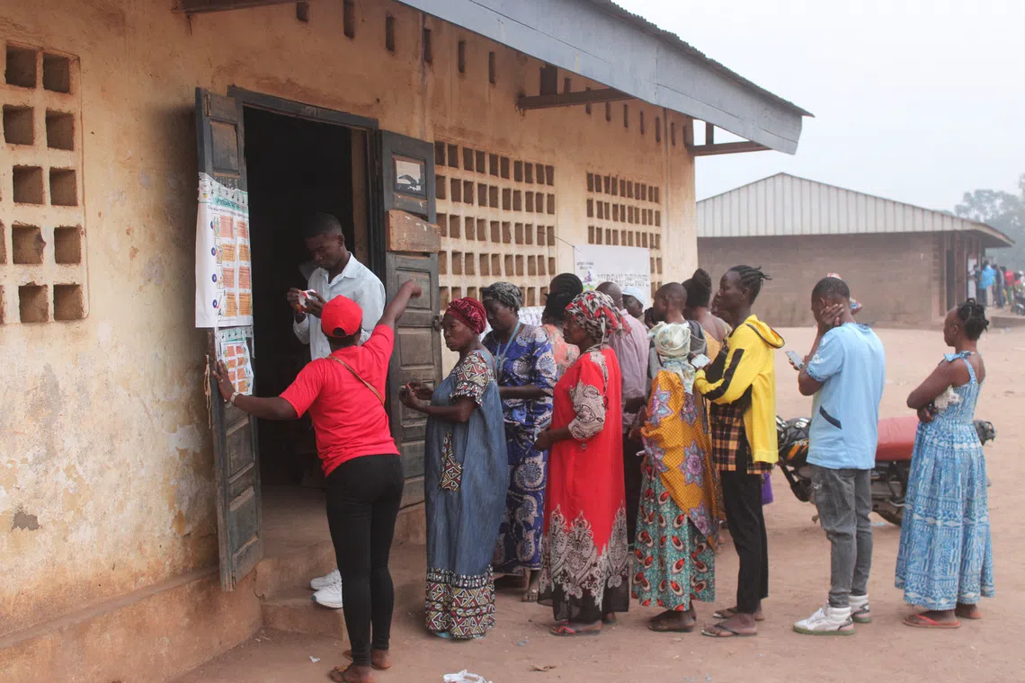 People wait to cast their vote at a polling station during the presidential election in Bangui, Central African Republic, December 28, 2025. REUTERS/ Leger Serge Kokpakpa