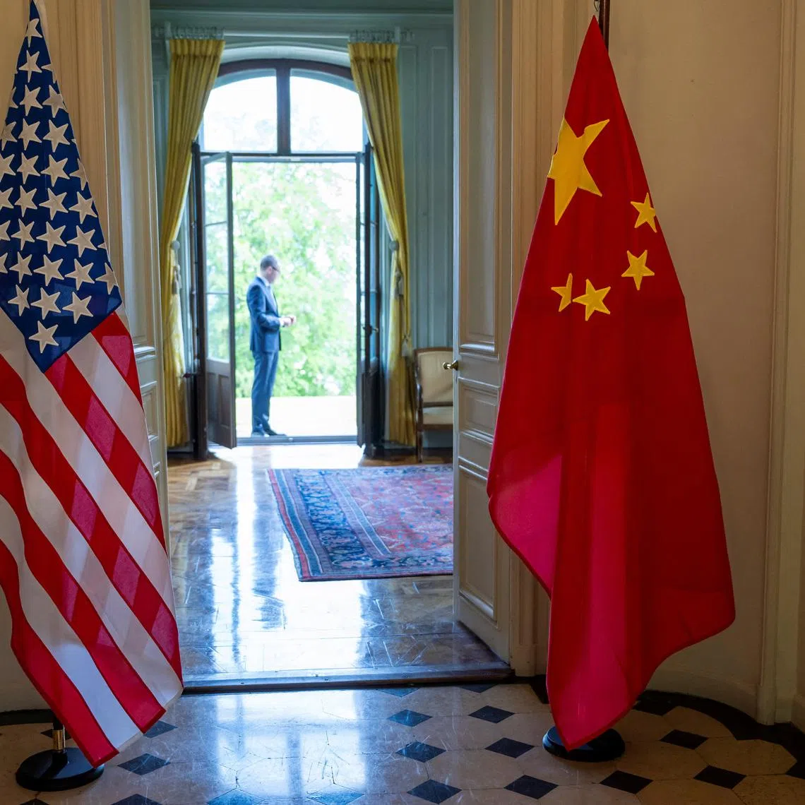 The U.S. and Chinese flags are seen on the day of a bilateral meeting between the U.S. and China, in Geneva, Switzerland, May 10, 2025. KEYSTONE/EDA/Martial Trezzini/Handout via REUTERS/File Photo