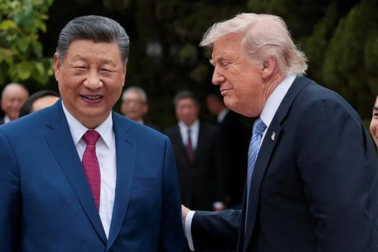 US President Donald Trump (right) and Chinese President Xi Jinping at their meeting in Beijing on May 15.
